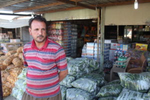 Tvåbarnspappan Adel Khodr Suleiman återvände till Snuni efter åtta månader i flyktingläger i Turkiet. Han återöppnade sin matbutik men affärerna går uselt. 
