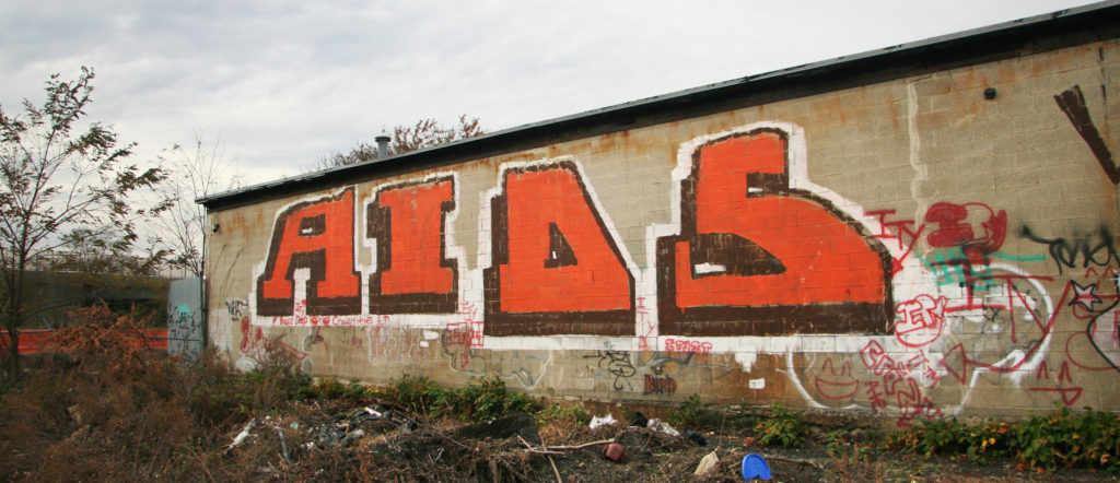 Graffiti, jossa lukee AIDS